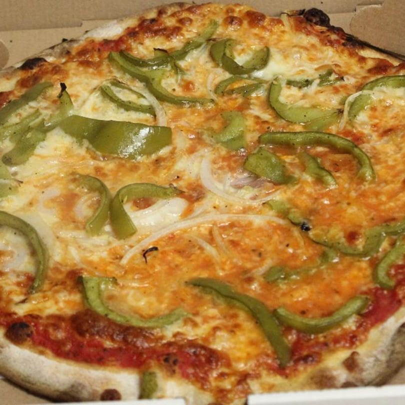 Marco Pizzeria's pizza with melted cheese, green peppers, and onions in a delivery box.